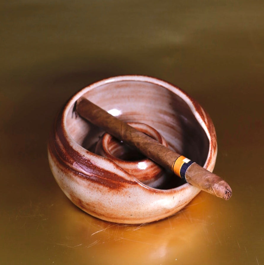 Luxurious brown ashtray with a sleek, functional form, designed to complement office décor and home aesthetics.
