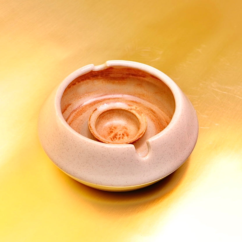 Luxury ashtray featuring a sculptural design and warm cream-brown palette – ideal for curated bookshelves, office décor, and living spaces.