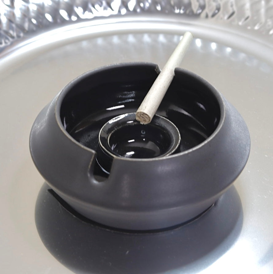 Refined black designer ashtray, perfect for enhancing interior spaces or gifting to a distinguished gentleman.