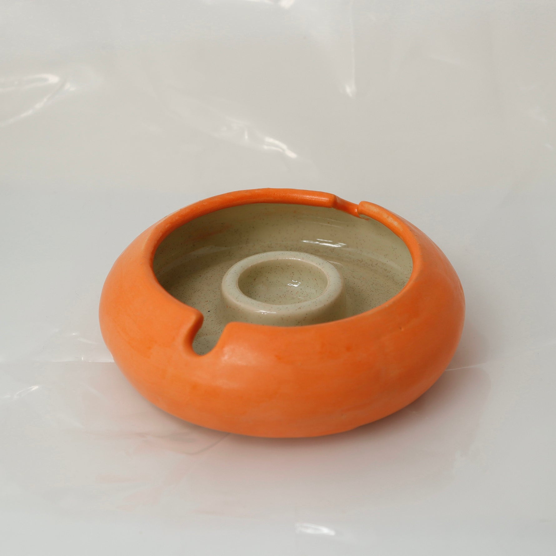 Sculptural ashtray in a rich tangerine tone – a luxury décor piece perfect for home styling, tabletop layering, and versatile storage.