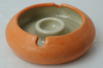 Bright and bold luxury ashtray in a tangerine-inspired color, doubling as a decorative tray for jewelry or stacked coffee table design.