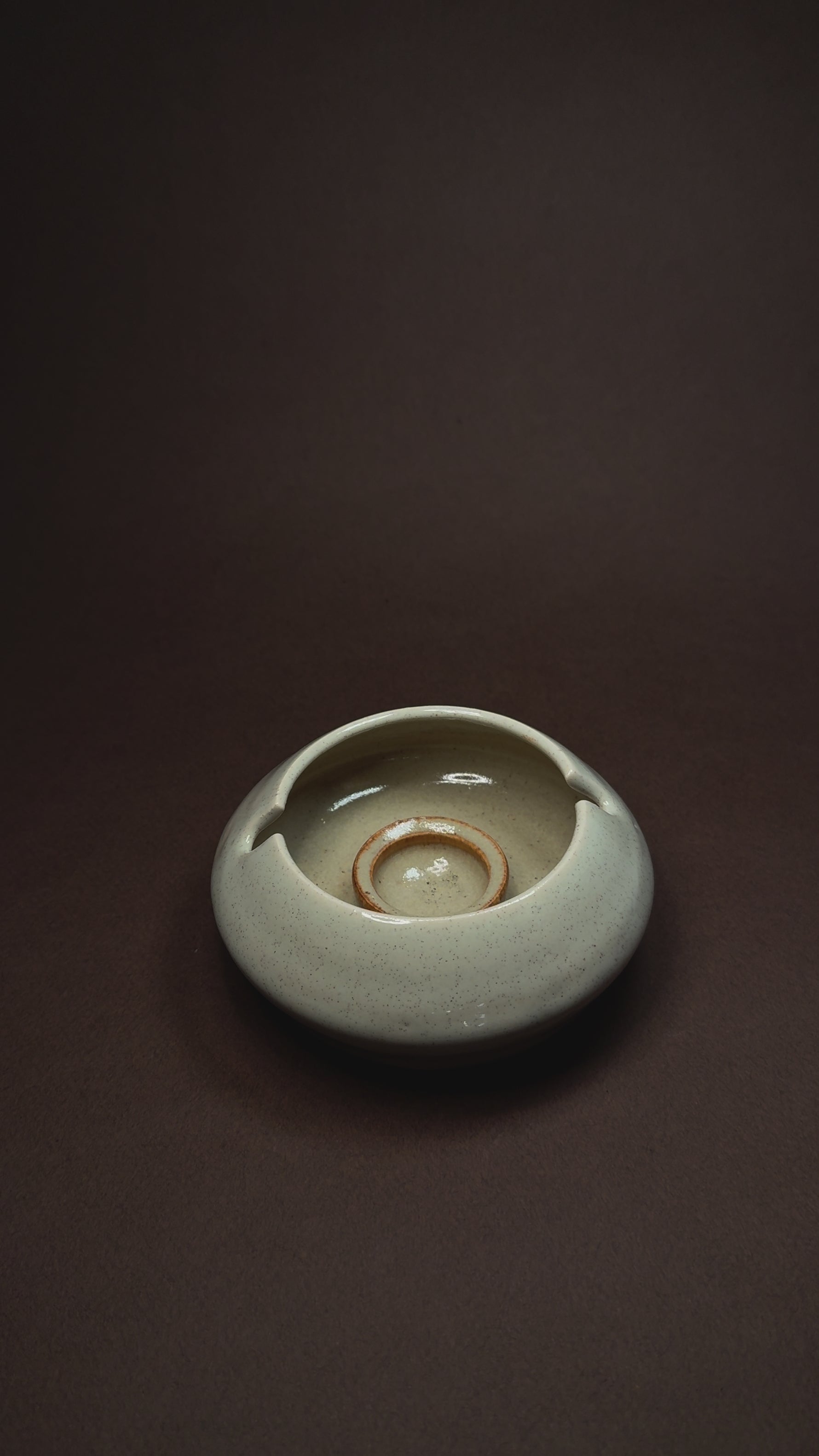 Cream and brown artistic ashtray with a luxury finish, perfect for adding sophistication to interior spaces, shelves, and table settings.